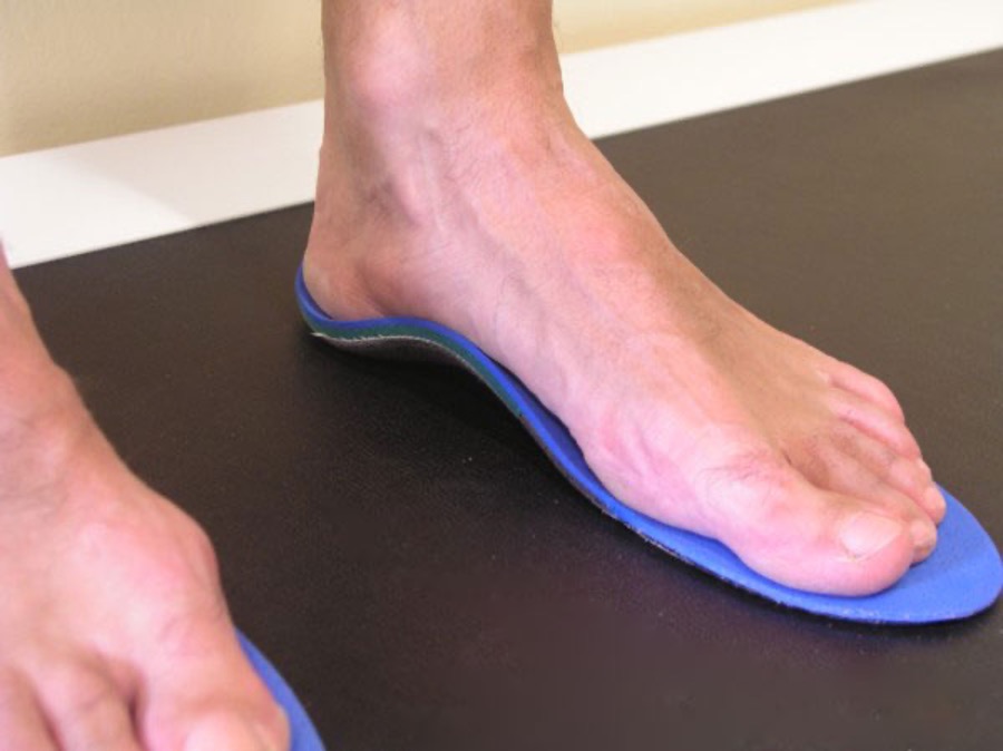 Feet standing over templates