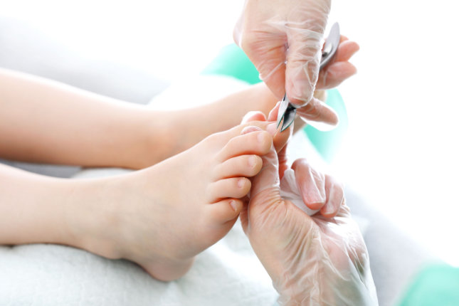 Feet standing over assesment device