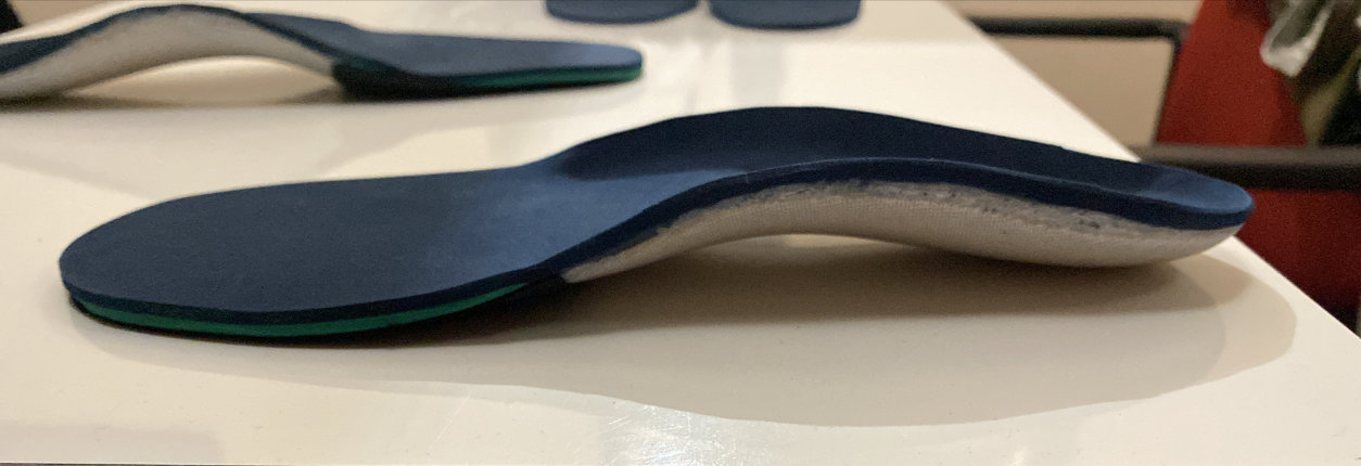 Feet standing over assesment device